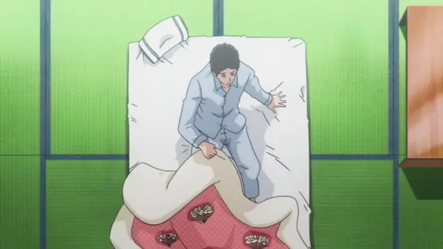 A man in blue pajamas lies on a bed, looking shocked as a woman, covered by a floral comforter, lies beside him. Screenshot from Otome Dori - Episode 2