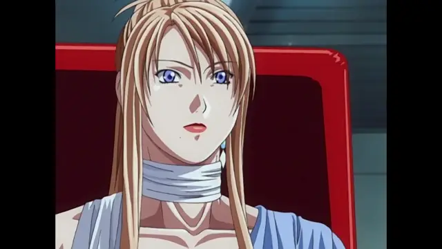 A blonde anime woman with blue eyes sits in a red chair, looking stunned with a thick white cloth tied around her neck. Screenshot from Discipline - Episode 6