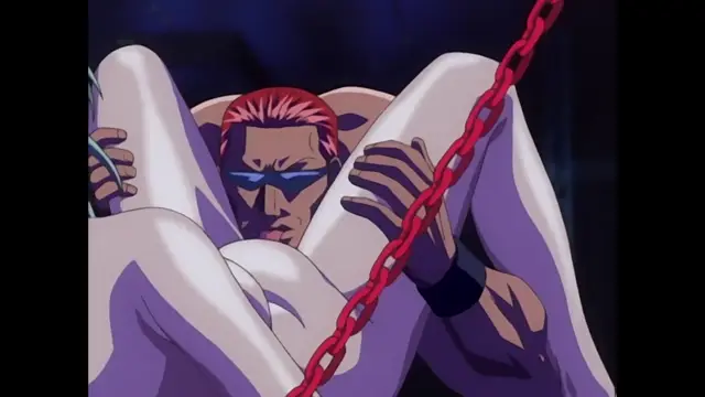 A muscular man with red hair and blue shades is tied up with a heavy red chain and bound in a white garment as he sits with his legs raised. Screenshot from Discipline - Episode 6