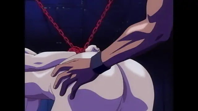 A muscular man with dark skin and a black wristband reaches down to grip the buttock of a naked woman who is being restrained by a red chain collar in a dark room. Screenshot from Discipline - Episode 6