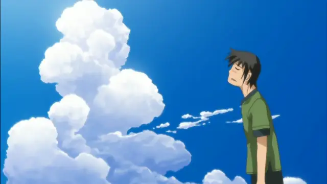 A young man with black hair and a green shirt stands with his eyes closed, looking upwards toward a massive, towering white cumulus cloud against a clear blue sky. Screenshot from Mama Puri!? - Episode 1