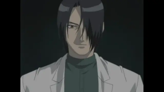 A man with black hair and a serious expression wears a white suit jacket over a dark green shirt. Screenshot from Cambrian - Episode 1