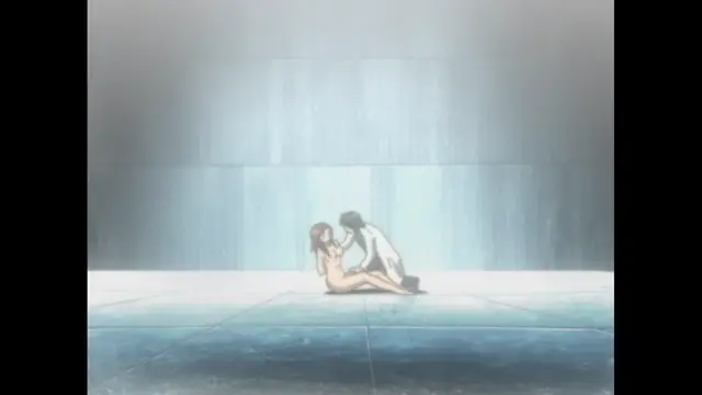 A woman sits on a light-blue tiled floor while a man in a white shirt kneels over her, their bodies close together in a misty, indoor setting. Screenshot from Cambrian - Episode 1