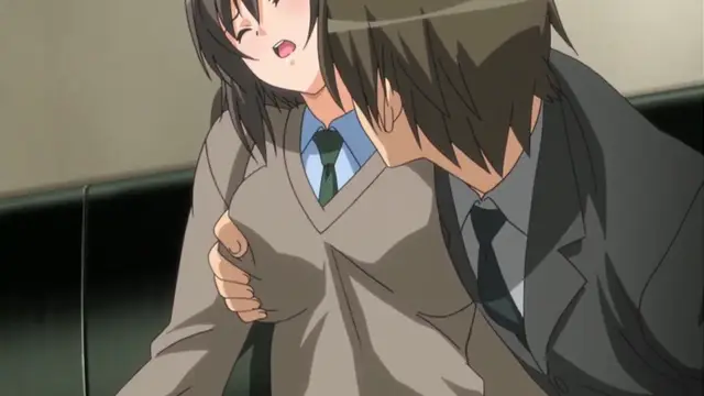 A girl with long brown hair and a school uniform is shown with a shocked expression as a man in a suit leans in close to her face and grabs her chest. Screenshot from Yume Kui: Tsurumiku Shiki Game Seisaku - Episode 1