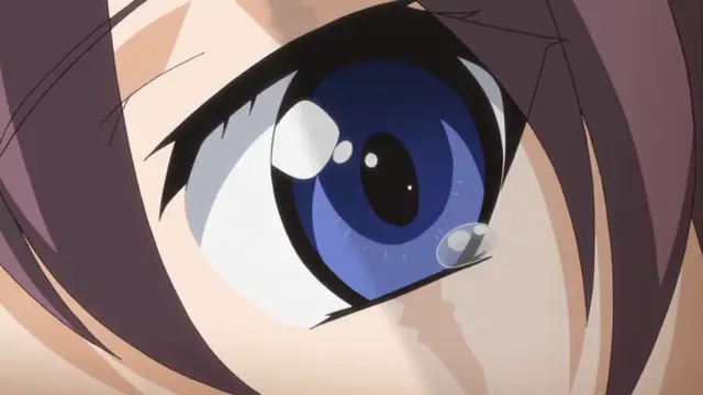 An extreme close-up of a girl's face with large blue eyes, featuring a tear and a shocked expression. Screenshot from Yume Kui: Tsurumiku Shiki Game Seisaku - Episode 1