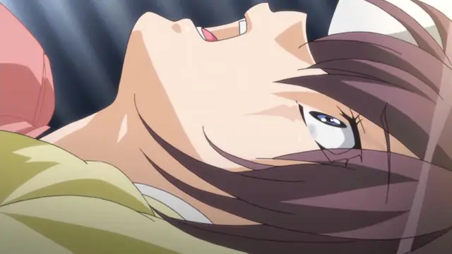 A close-up of a brown-haired anime girl with a distressed expression, her head tilted back and eyes wide with sweat and tears, while being pinned down by a person with pink hair. Screenshot from Yume Kui: Tsurumiku Shiki Game Seisaku - Episode 1