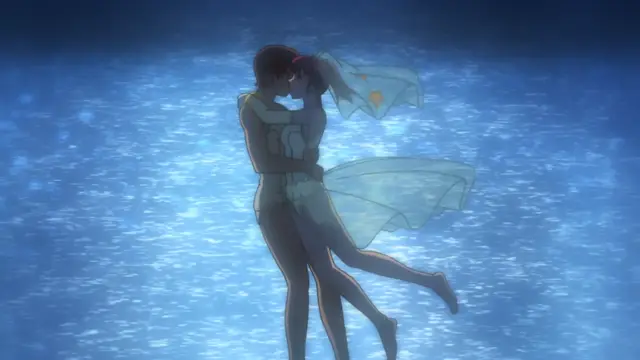 A man and a woman in swimwear are embracing and kissing in the middle of a blue ocean. Screenshot from Tsundere Inran Shoujo Sukumi - Episode 2