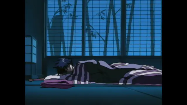 A dark-haired man with a striped yukata lies face down on a tatami mat in a traditional room, looking exhausted as he sleeps in front of a sliding door with bamboo patterns. Screenshot from Guren - Crimson Lotus - Episode 1