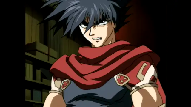 A male anime character with spiky black hair, a serious expression, and a red cape over a dark blue outfit stands in a dimly lit room. Screenshot from Guren - Crimson Lotus - Episode 3