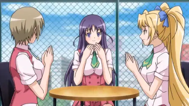 Three girls in school uniforms sit around a small table, with the girl in the middle looking startled as the others face her. Screenshot from Toriko Hime Hakudaku Mamire no Reijou - Episode 1
