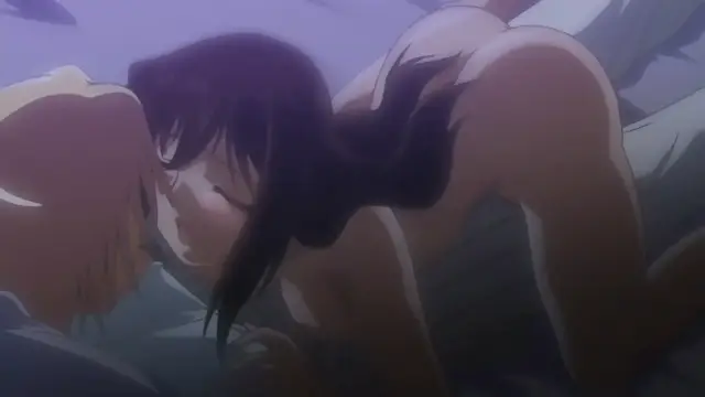 A woman with long dark hair is positioned over a man with light hair, leaning down to kiss his face while her body is pressed against him. Screenshot from Samayou Midara na Lunatics - Episode 1