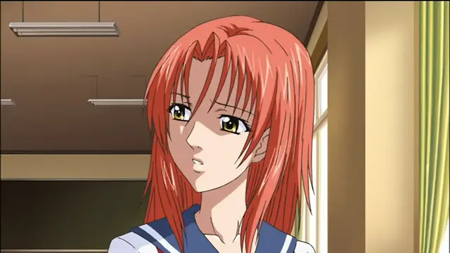 A red-haired girl in a school uniform looks surprised or shocked with her mouth slightly open in an indoor setting. Screenshot from Sailor Fuku Shinryou Tsumaka - Episode 2