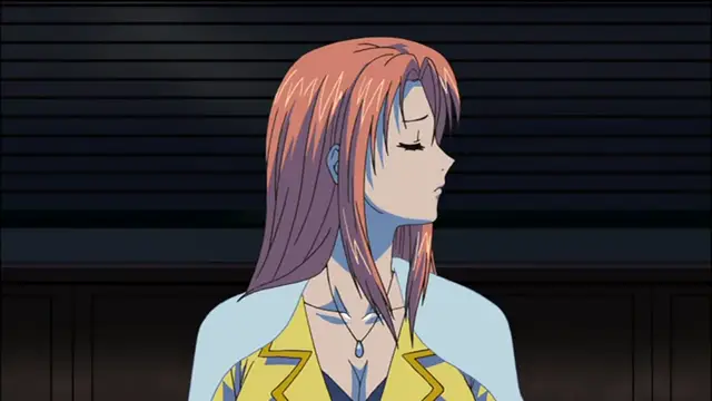 An anime woman with long, reddish-brown hair and a yellow suit jacket looks downward with a pained or heavy expression against a dark background. Screenshot from Sailor Fuku Shinryou Tsumaka - Episode 2