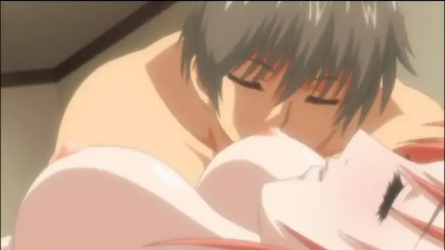 A shirtless man with dark hair leans over a female character lying on a bed, pressing his face against her chest as they share an intimate moment. Screenshot from Sailor Fuku Shinryou Tsumaka - Episode 2