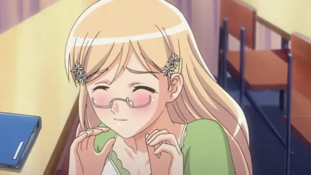A blonde anime girl with glasses and a blush on her cheeks sits in a classroom, looking bashful and nervous. Screenshot from Fault!! - Episode 1