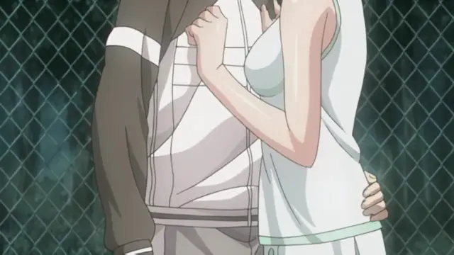 A young man and woman stand close together in front of a chain-link fence, with the man's arm around the woman's waist as she leans against him. Screenshot from Fault!! - Episode 1