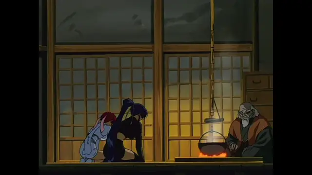 A young woman with dark hair and a white kimono is kneeling on the floor in front of an old man as she appears to be performing a sexual act on herself or him while a cauldron boils nearby. Screenshot from The Last Kunoichi - Episode 2