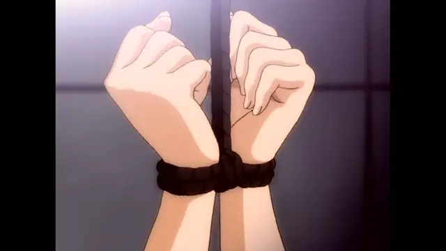 Two hands are bound together with black rope and tied to a central pole in a vertical position. Screenshot from The Immorals - Episode 2