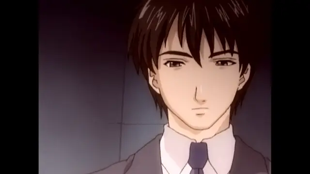 A young man with dark hair, wearing a suit and tie, looks forward with a serious expression. Screenshot from The Immorals - Episode 2