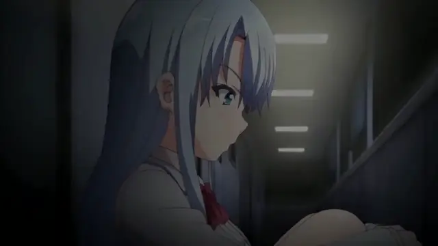 A blue-haired anime girl in a school uniform sits on a train looking downwards with a blushing face. Screenshot from Chiisana Tsubomi no Sono Oku ni - Episode 2
