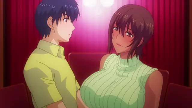 A blushy-faced girl with large breasts and a green sweater leans in close to a shocked young man in a yellow shirt while sitting in a theater-like setting with red curtains. Screenshot from Kaa-chan no Tomodachi ni Shikotteru Tokoro Mirareta The Animation