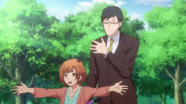 A brown-haired anime girl in a pink kimono stands with her arms outstretched and a joyful expression while a man in a suit stands behind her with a neutral expression in a lush green park. Screenshot from Eternity: Shin`ya no Nurekoi Channel - Episode 2