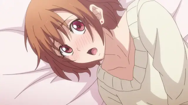 A blushing anime girl with short brown hair lies on a bed, looking startled with wide eyes and an open mouth while wearing a cream-colored sweater. Screenshot from Eternity: Shin`ya no Nurekoi Channel - Episode 2
