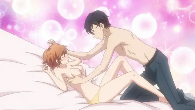 A shirtless man with dark hair leans over a woman with orange hair on a bed, placing his hands on her chest and torso while she lies back with her eyes closed against a sparkly pink background. Screenshot from Eternity: Shin`ya no Nurekoi Channel - Episode 2