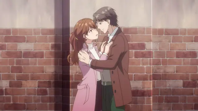A man in a brown coat and green pants leans in closely to a woman in a pink coat against a brick wall, his hands on her shoulders as they share an intimate gaze. Screenshot from Eternity: Shin`ya no Nurekoi Channel - Episode 4