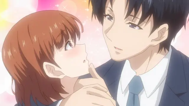 A blushing girl with short brown hair looks up at a tall man with black hair and a blue tie who is holding her chin with his hand. Screenshot from Eternity: Shin`ya no Nurekoi Channel - Episode 7