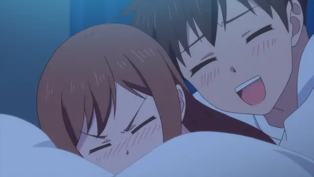 A blushing anime girl with brown hair lies in bed, looking annoyed and grumpy, while a smiling anime boy with dark hair lies next to her, laughing heartily. Screenshot from Overflow - Episode 2