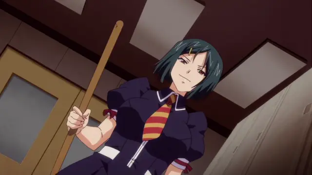 A high-angle shot shows a girl with short dark blue hair wearing a school uniform with a red and yellow striped tie, holding a wooden staff and smiling confidently in an indoor hallway. Screenshot from Otome Chibaku Yuugi - Episode 1