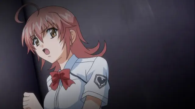 A shocked anime girl with pink hair wearing a white school uniform with a red bow stands in a dark room with a surprised expression. Screenshot from Kansen 2 Inzai Toshi - Episode 1