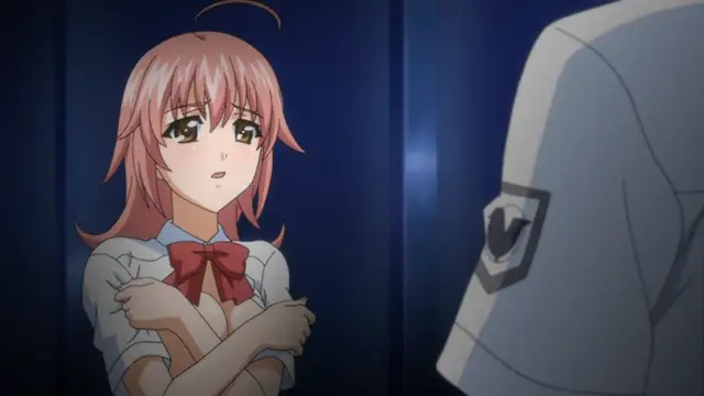 A blushing pink-haired girl in a school uniform with a red bow stands with her arms crossed and an embarrassed expression while facing a man in a police uniform. Screenshot from Kansen 2 Inzai Toshi - Episode 1