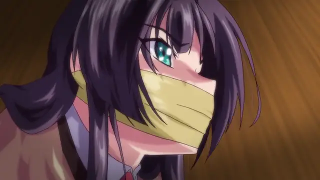 A girl with long dark hair and a blue eye is shown with a yellow tape gag covering her mouth, looking forward with a frustrated expression. Screenshot from Tokubetsu Jugyou 3 SLG - Episode 2