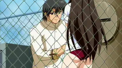 A man with dark hair and a serious expression sits next to a woman with long brown hair and red underwear, both positioned in front of a chain-link fence. Screenshot from Futari no Aniyome - Episode 2