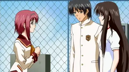 A girl with short pink hair stands on the left looking towards a boy in a white school uniform and a long-haired girl on the right, who are standing together in front of a chain-link fence. Screenshot from Futari no Aniyome - Episode 2