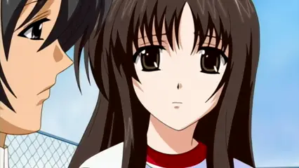 A high-angle medium shot shows a brown-haired anime girl with a concerned expression standing next to a black-haired anime man who is looking at her with a serious look. Screenshot from Futari no Aniyome - Episode 2
