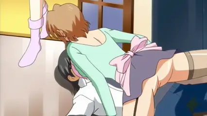 In this anime scene, a woman with short brown hair in a light blue long-sleeved top and a grey skirt is shown from behind as she leans over and straddles a woman with dark hair who is sitting on a chair, while a third person's legs, clad in white socks and pink boots, are raised in the air behind them. Screenshot from Futari no Aniyome - Episode 1