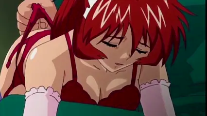 A red-haired girl in a maid outfit with a ruffled headpiece and white arm warmers lies face down on a green bed with her eyes closed in pleasure, her red lingerie revealing large breasts while a hand pulls her underwear from behind. Screenshot from Hinadori no Saezuri - Episode 2