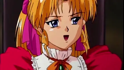 A close-up shot of a blonde anime girl with large blue eyes and a surprised expression, wearing a red dress with white ruffled sleeves and a gold and green brooch. Screenshot from Hinadori no Saezuri - Episode 1